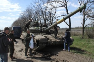 Ukrainian church members hand out Christian materials to soldiers